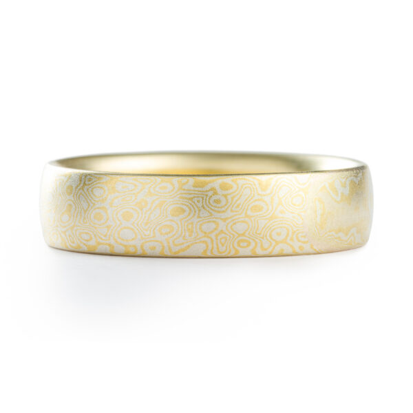 Gold and silver mokume gane patterned ring by arn krebs, pattern resembles droplets hitting the surface of water
