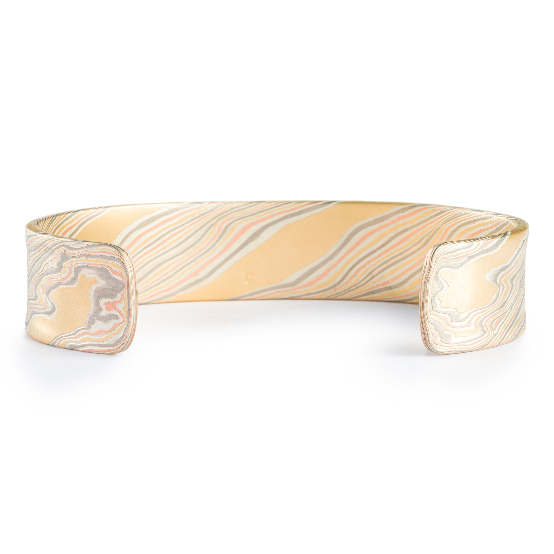 Mokume gane patterned mens bangle, wide, slightly textured, made with yellow gold, red gold, palladium and silver.