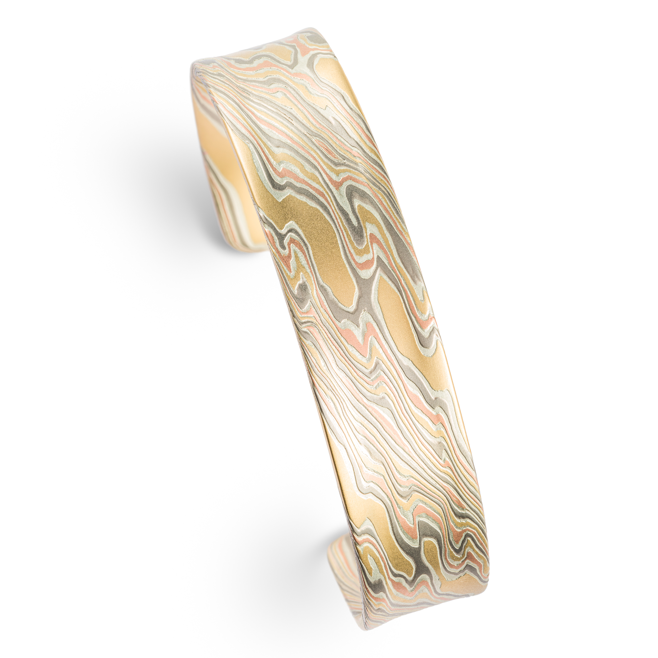 Mokume gane patterned mens bangle, wide, slightly textured, made with yellow gold, red gold, palladium and silver.