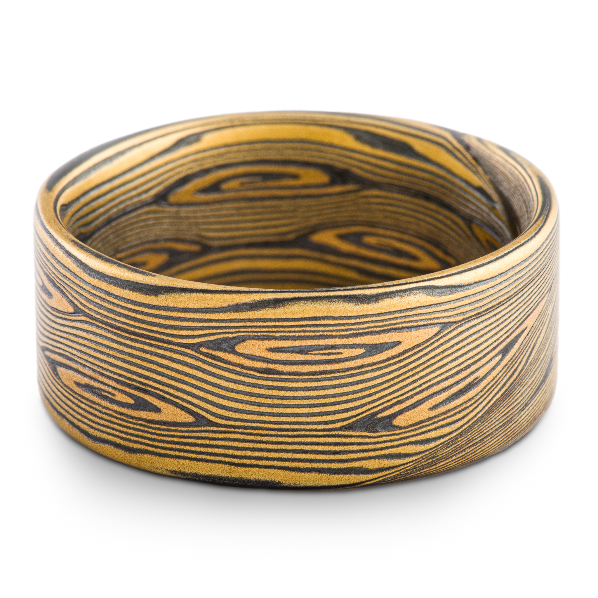 Wide 22kt gold men's mokume gane ring patterned with fine flowing lines with spirals. High contrast with yellow gold and oxidized silver.