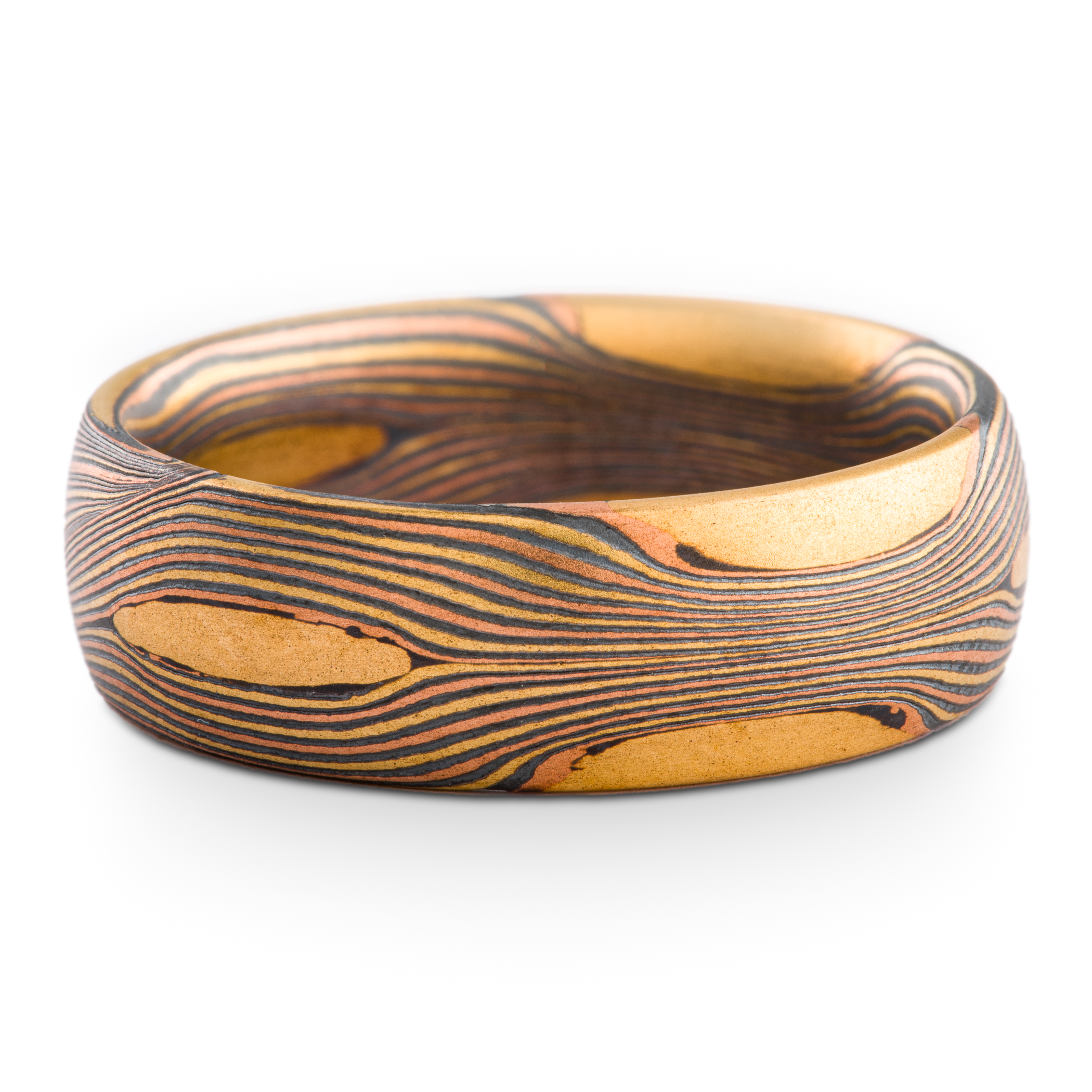 Arn Krebs Mokume Gane patterned ring, made with thin flowing lines of gold with yellow gold patches interspersed.