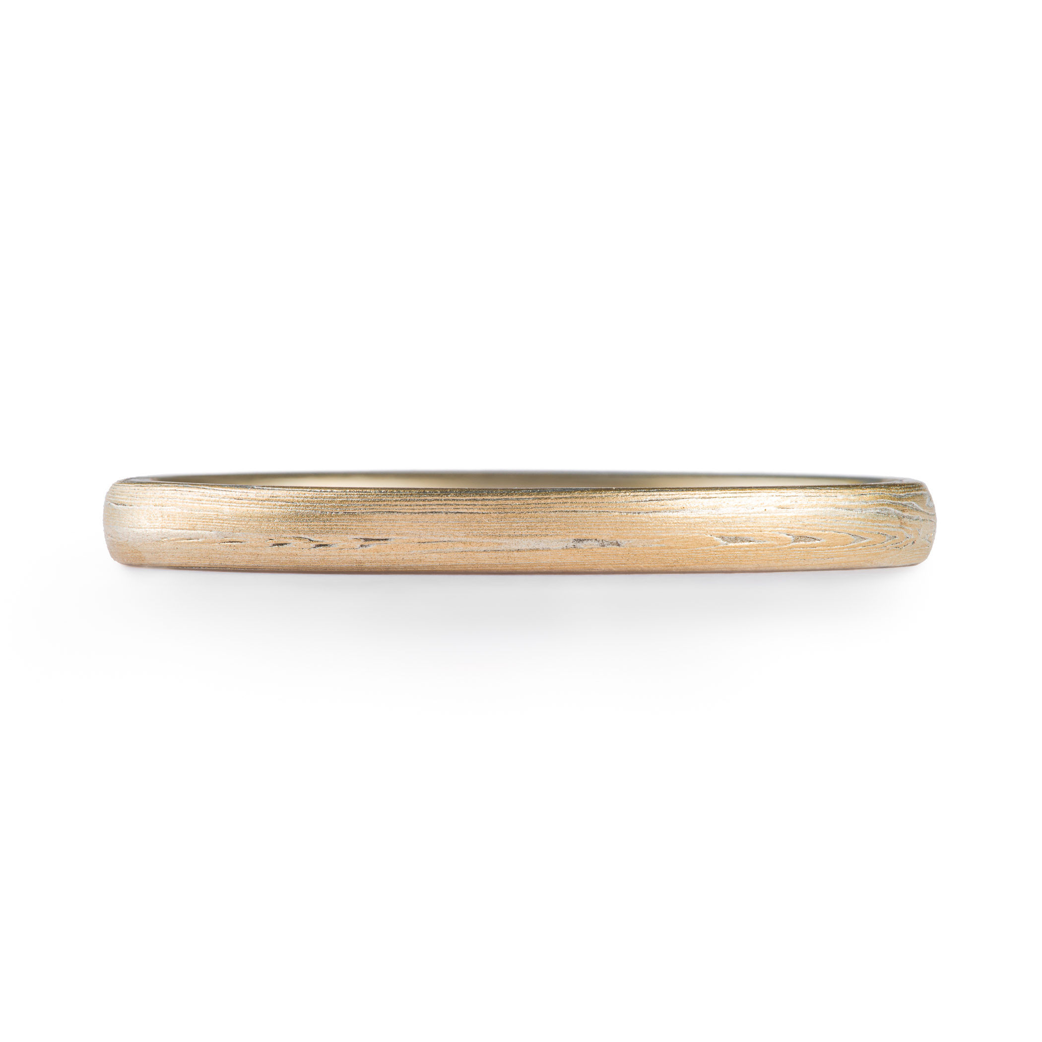 Arn Krebs mokume gane ring patterned in a subtle linear style in his vortex pattern. Made with yellow gold and silver.