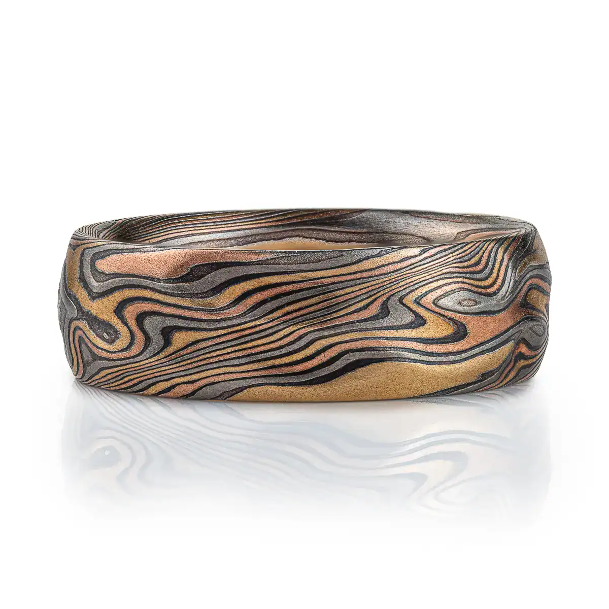 arn krebs mokume gane handmade wedding ring, in twist pattern and Firestorm palette with red gold yellow gold palladium and oxidized silver